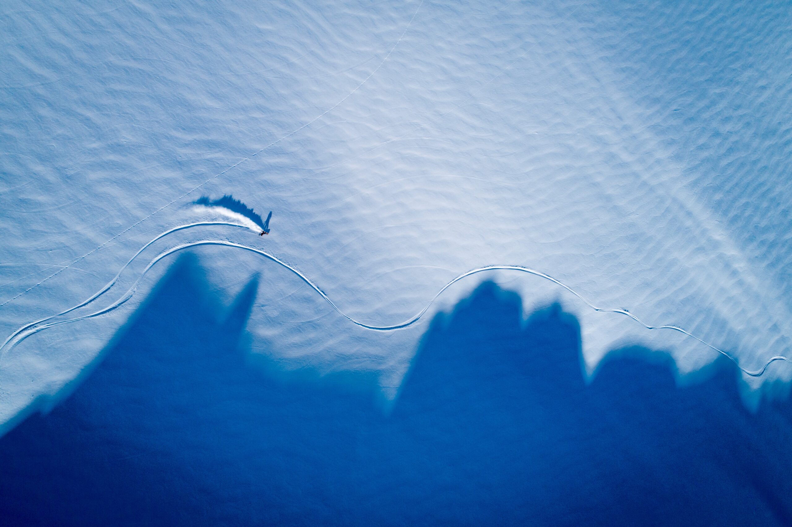 Verbier ski rental shadows mountains skiers